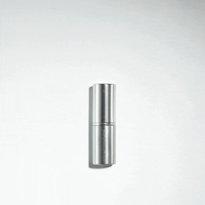 Otis Batterbee travel retractable kabuki powder makeup brush.