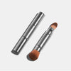 Retractable makeup brush by Otis Batterbee has one side that id a foundation and concealer brush and one end that is a chic powder brush.