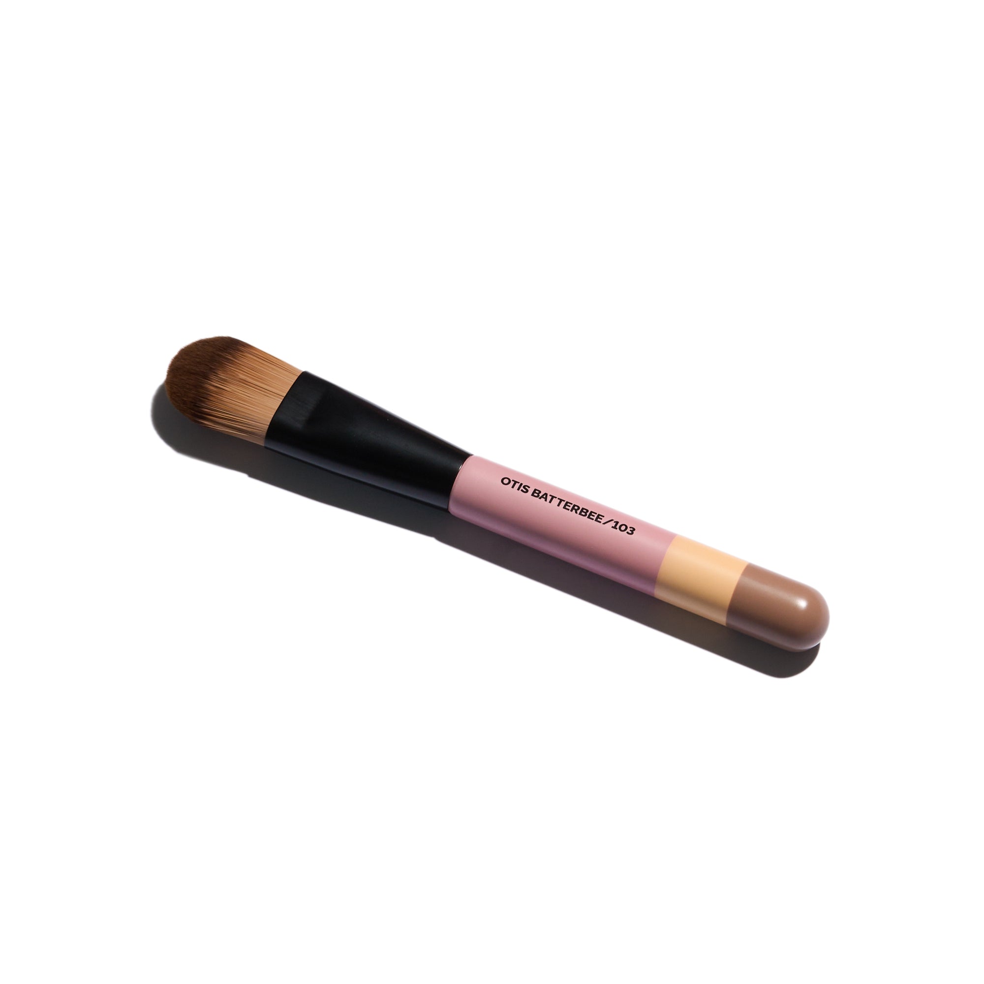 Otis Batterbee Foundation Makeup Brush is designed for flawless foundation application. Its dense synthetic bristles and tapered shape effortlessly blend liquid or cream formulas, providing a smooth, even finish
