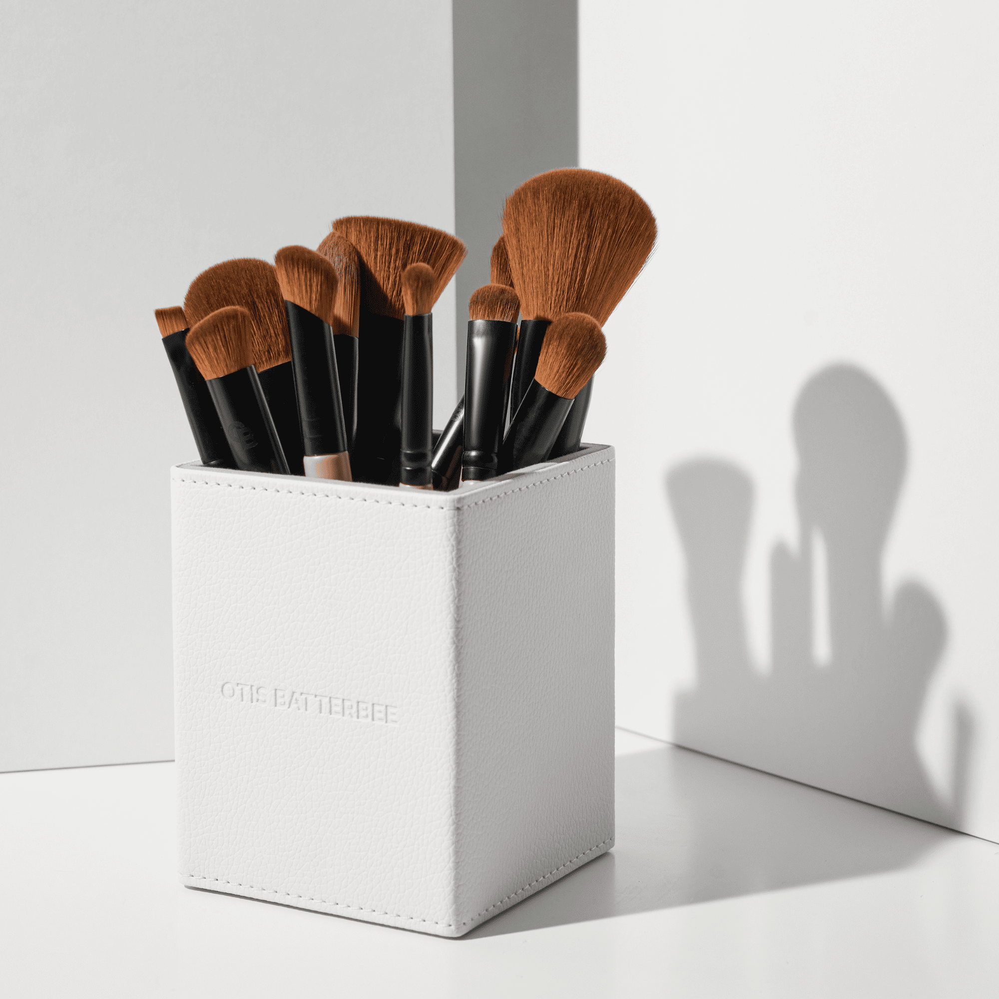 Professional makeup brush set by Otis Batterbee. The British beauty brand began with a vision to create makeup brushes that made everyone look flawless no matter what their skin type. After noticing that most makeup brushes were constructed from the same one-size-fits-all low-grade bristles, Otis set about developing his unique high-performance brushes that would apply beauty products from liquids to fine powders for a natural finish, no matter what your age.