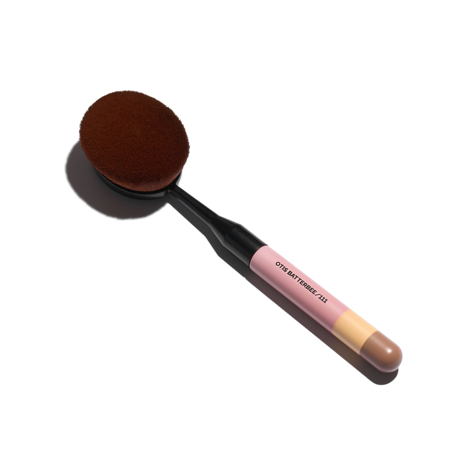 Image of a luxury oval makeup brush on white background