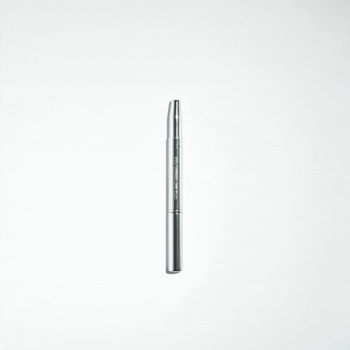 Designer travel retractable makeup brushes perfect to touch-up lips and brows.