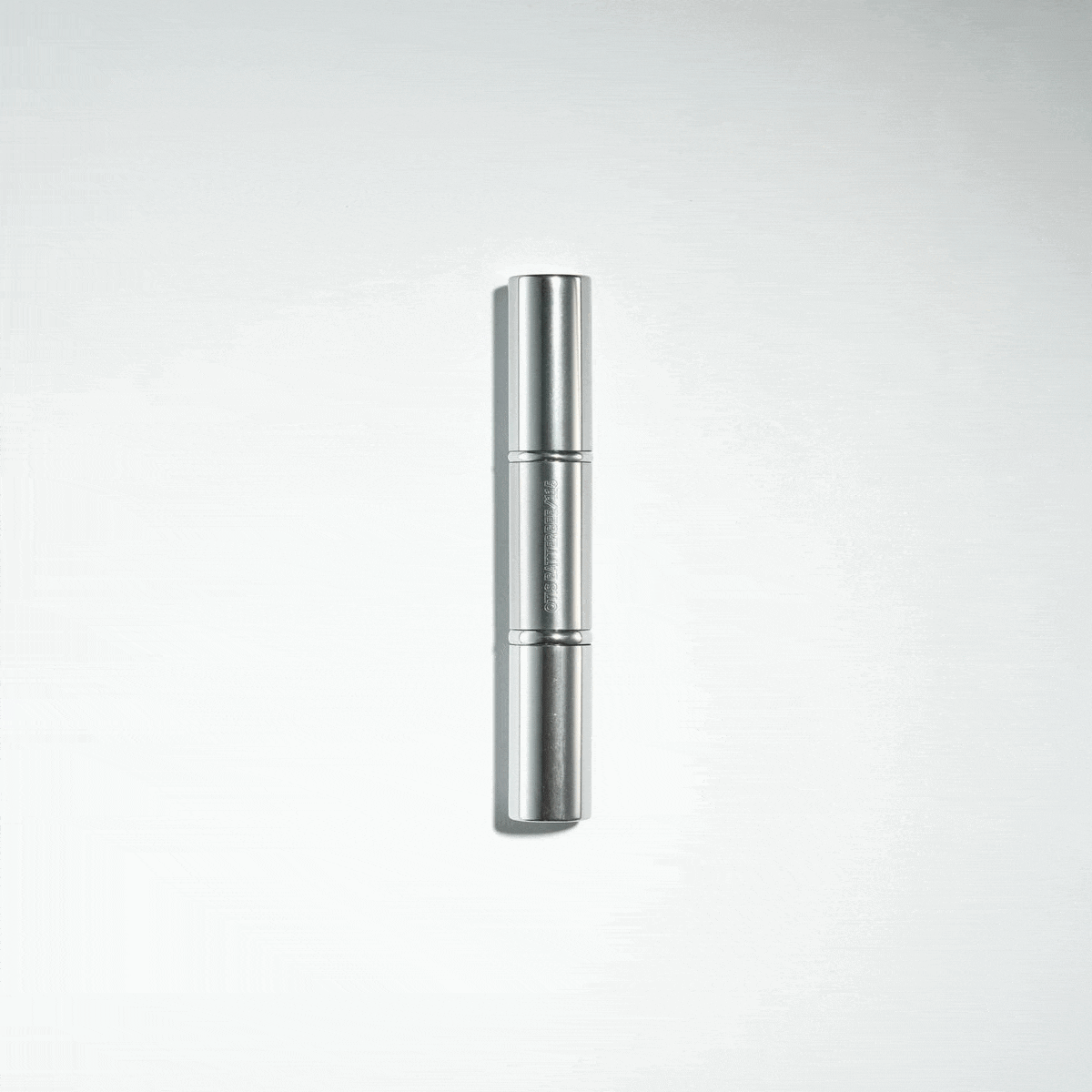 The Flawless face brush is a retractable design that houses a foundation brush on one end and a powder brush on the other all in a chic silver design.