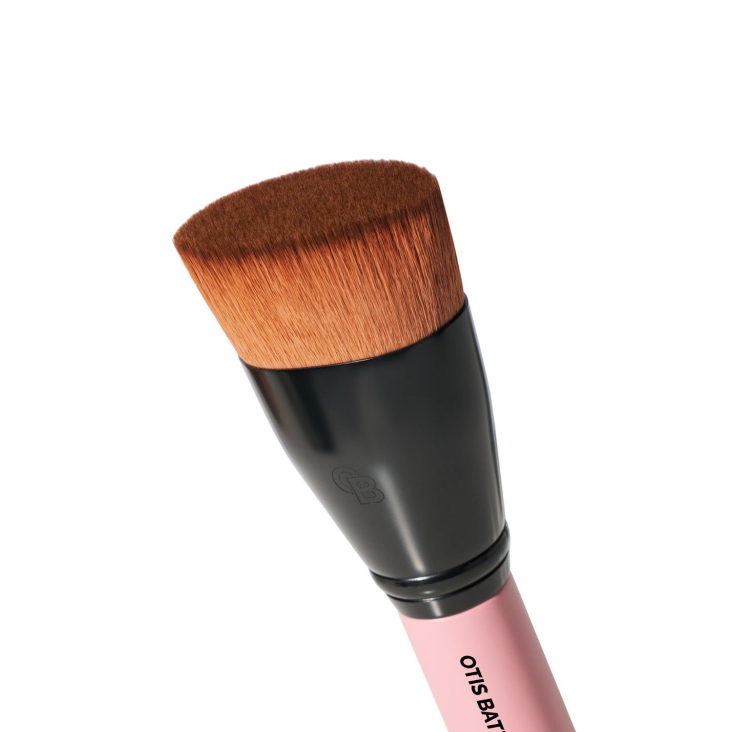 Makeup brush with brown bristle head and pink handle on a white background by Otis Batterbee