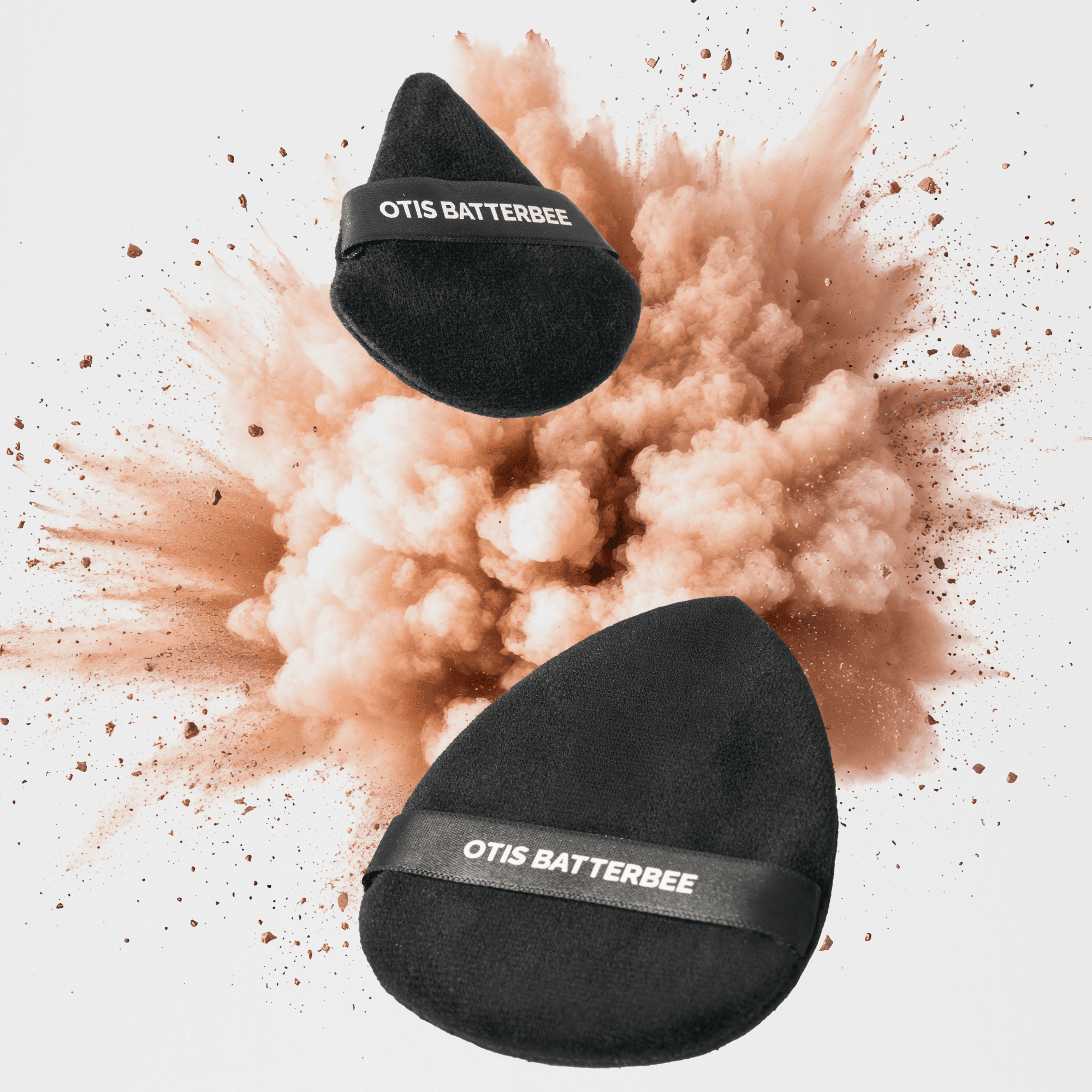 Powder puffs for setting loose powder over the face and body by Otis Batterbee.