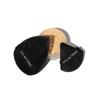 Black powder puffs by Otis Batterbee. Detailing powder puff and larger powder puff.