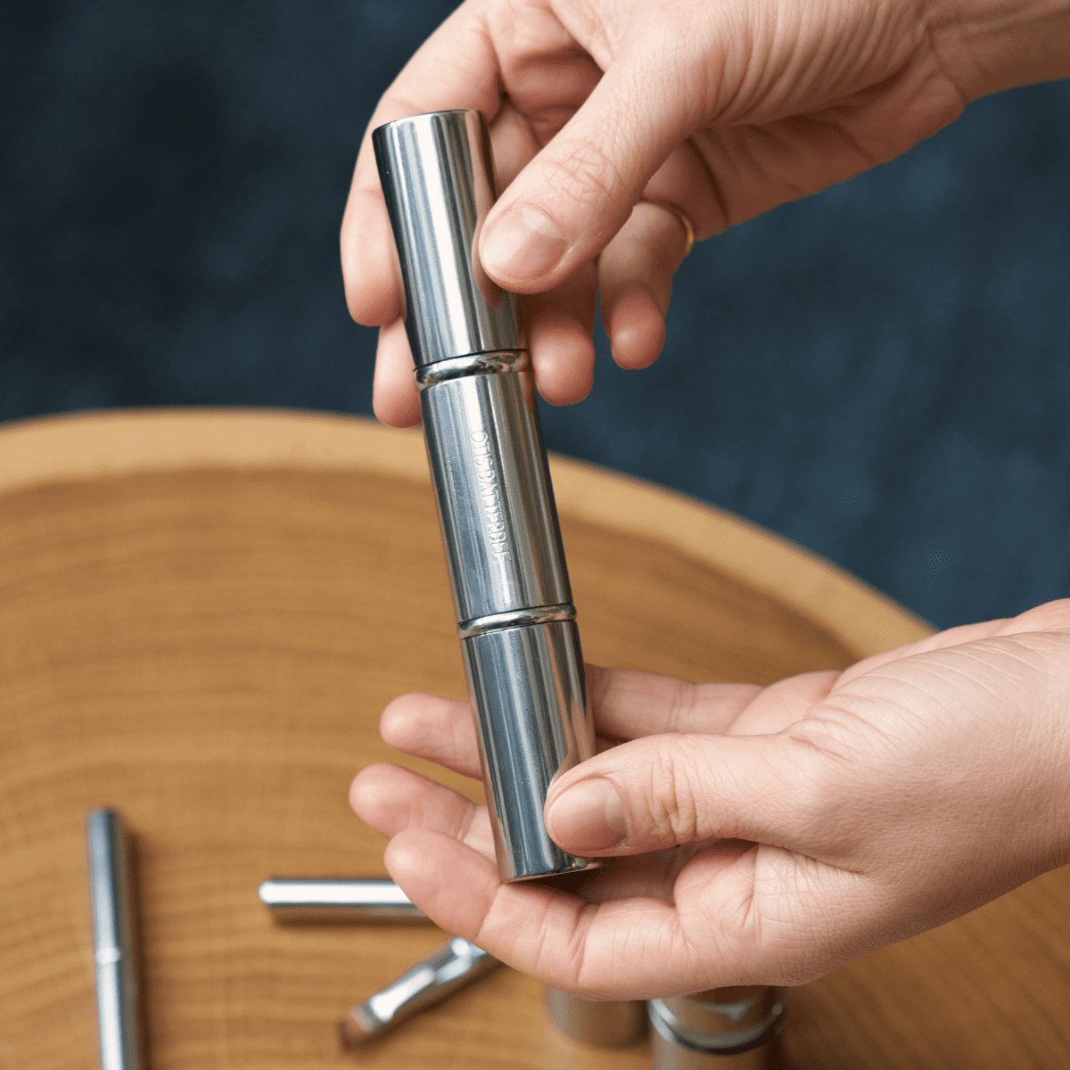 Otis Batterbee retractable face makeup brush.