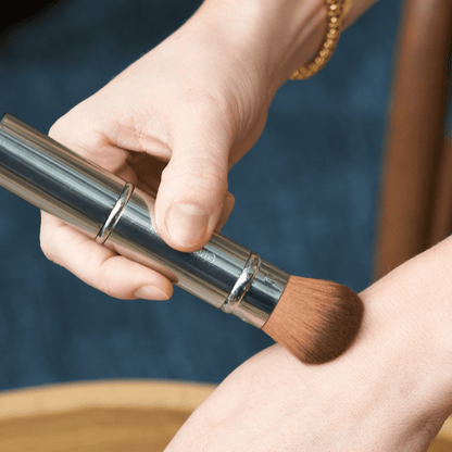 Retractable powder makeup brush by Otis Batterbee.