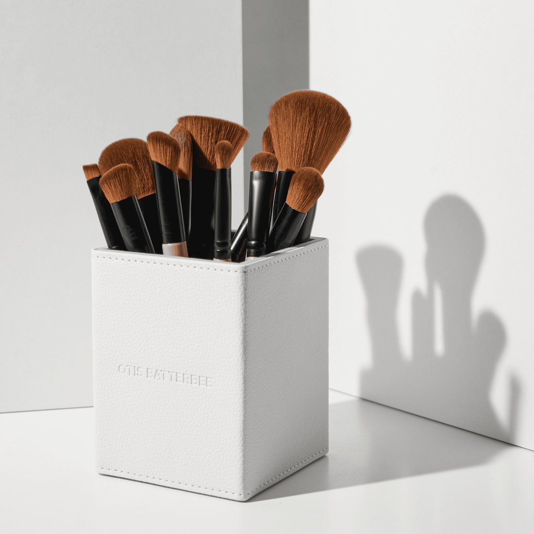 Professional makeup brush set by Otis Batterbee. The British beauty brand began with a vision to create makeup brushes that made everyone look flawless no matter what their skin type. After noticing that most makeup brushes were constructed from the same one-size-fits-all low-grade bristles, Otis set about developing his unique high-performance brushes that would apply beauty products from liquids to fine powders for a natural finish, no matter what your age.