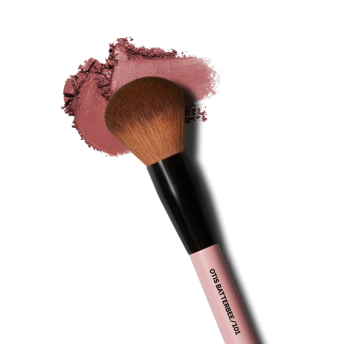 Close-up of Otis Batterbee Powder Brush with soft bristles coated in finely milled powder makeup for even application