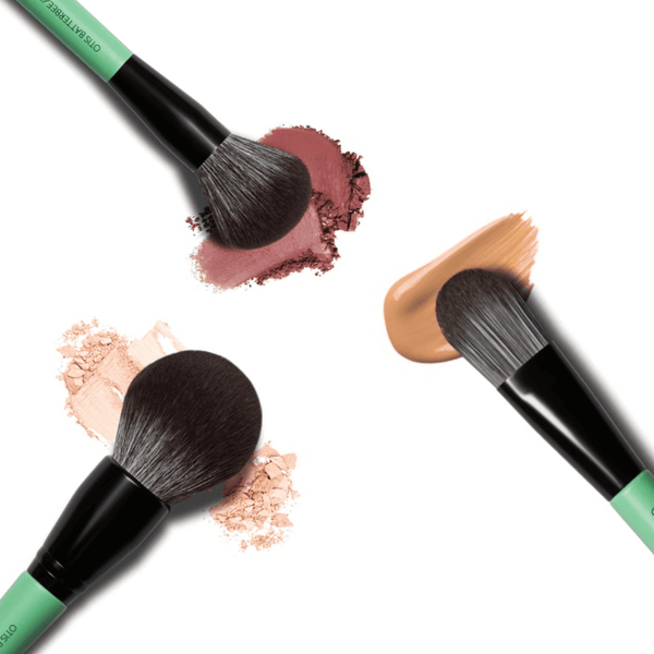 Green makeup brushes by Otis Batterbee. Powder makeup brush and powder makeup brush along with a foundation brush too.